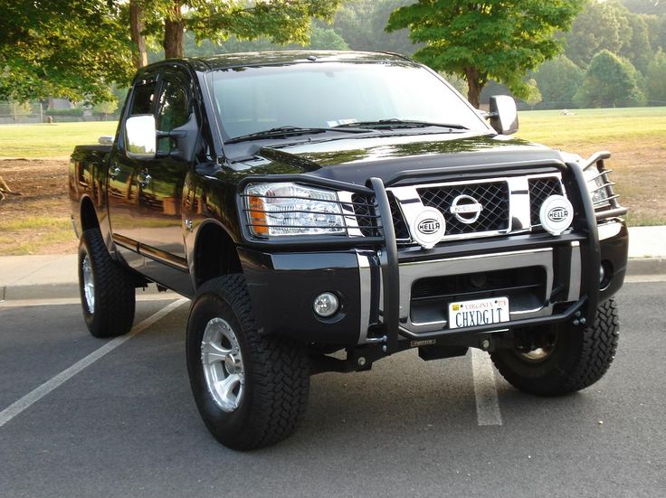 a black pickup truck parked in a parking lot