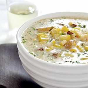 a white bowl filled with soup on top of a table