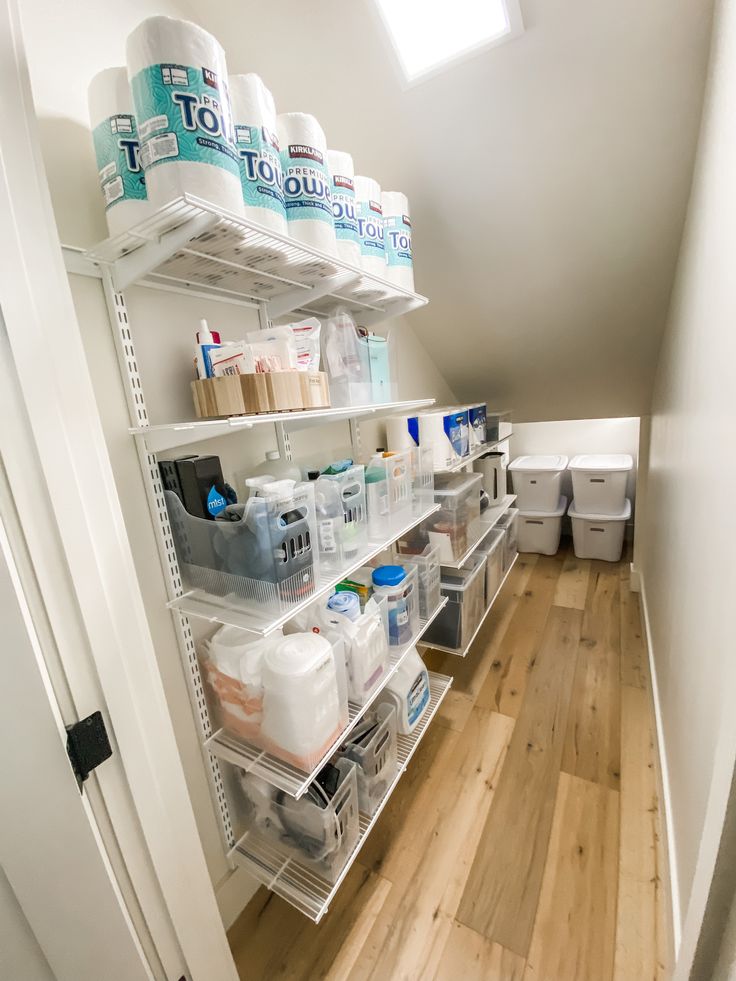 the shelves are organized and ready to be used in the bathroom or laundry room for storage