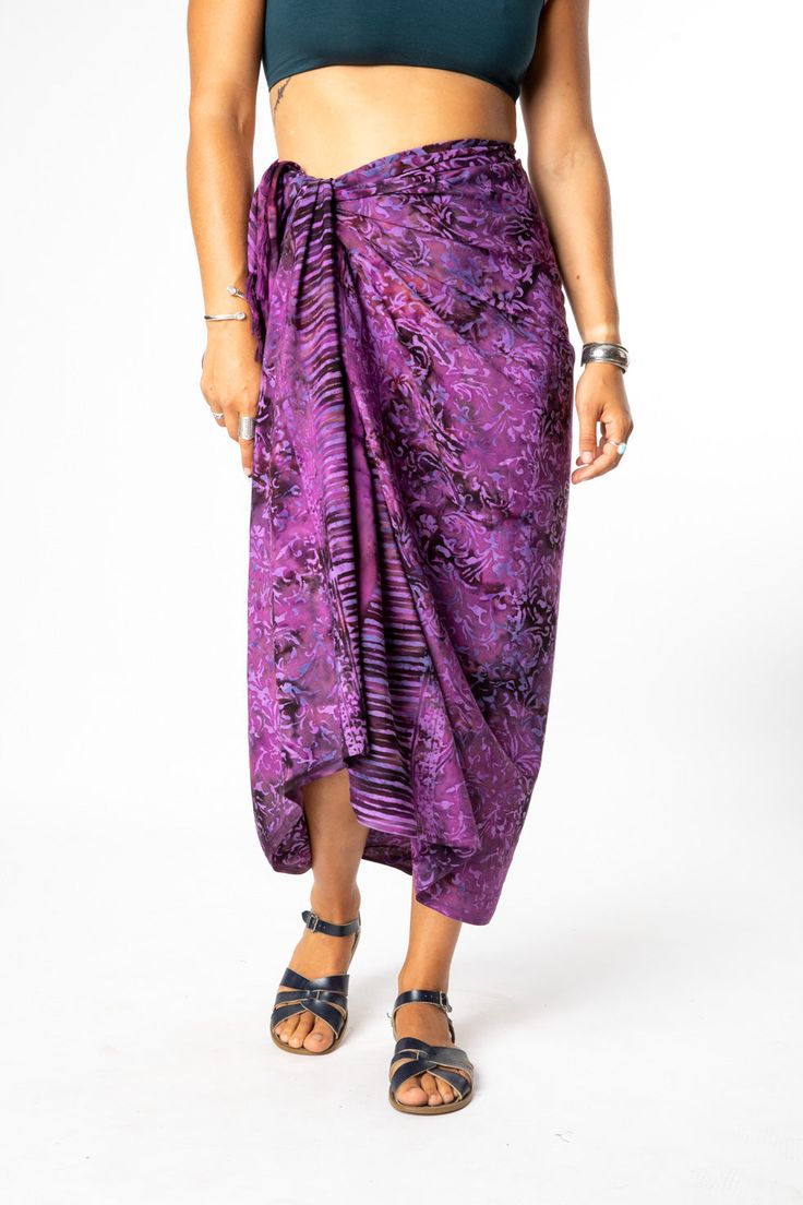 Set your watch to island time and embrace the artistic origins of our tasseled sarong wraps. Dyed with the traditional Indonesian batik method, the colors on this batik sarong are bright and vibrant, and the patterns are uniquely boho chic! From its traditional South Pacific use as a woman's or man's wrap skirt to a hippie skirt, a wall hanging, turban, tablecloth or window dressing, you will never run out of options with a beautiful batik sarong! All Mexicali Blues batik items are handmade in B Bohemian Style Sarong With Tropical Print For Beach Cover-up, Bohemian Tropical Print Sarong For Beach Cover-up, Bohemian Sarong With Vibrant Print For Vacation, Bohemian Vibrant Print Sarong For Vacation, Bohemian Multicolor Sarong With Vibrant Print, Multicolor Bohemian Sarong With Vibrant Print, Bohemian Batik Print Sarong For Festival, Bohemian Multicolor Tropical Print Sarong, Bohemian Multicolor Vibrant Print Sarong