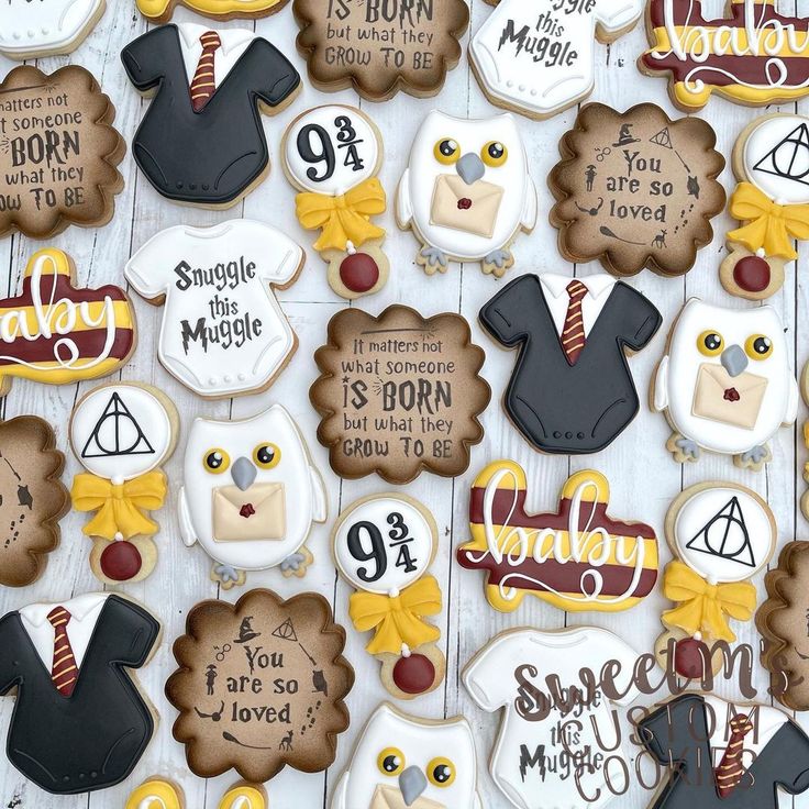 decorated cookies with harry potter sayings on them are displayed in front of a white background