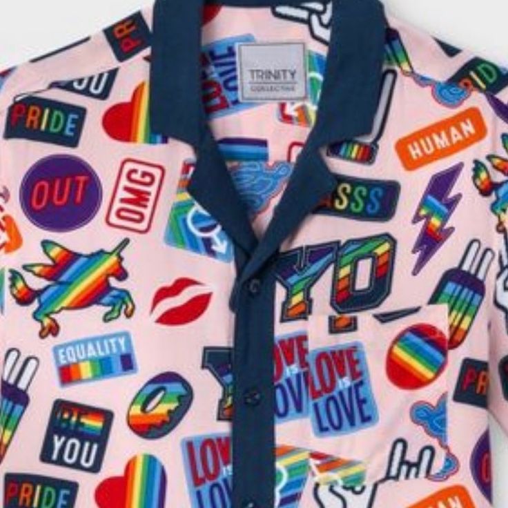 a pink shirt with colorful stickers all over it and the words love you pride on it