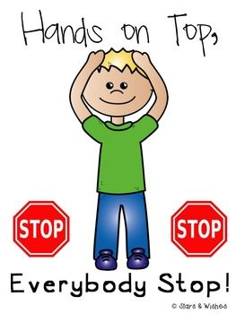 a boy holding his hands on top of his head and two stop signs below him