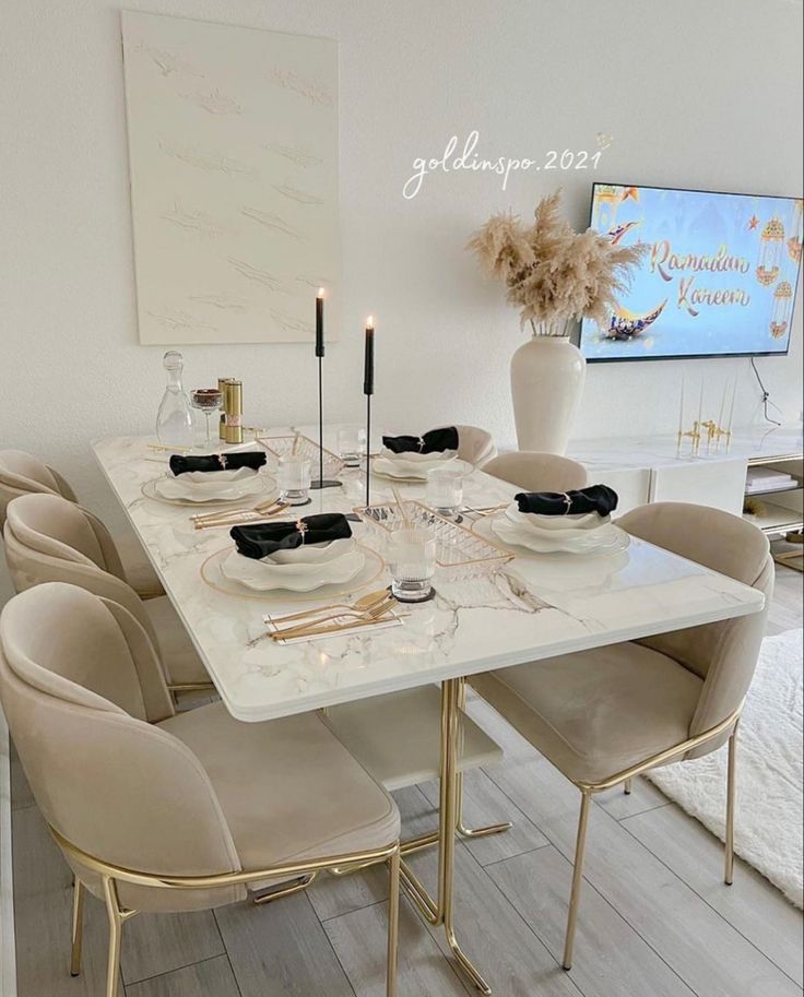 a dining room table is set with place settings