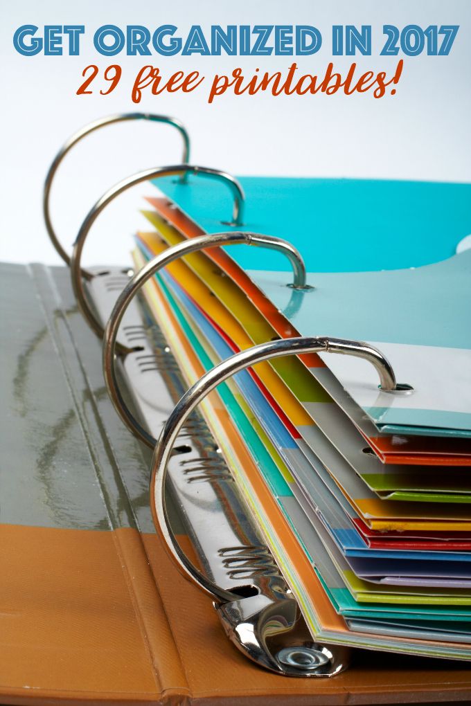 a stack of folders sitting on top of a desk