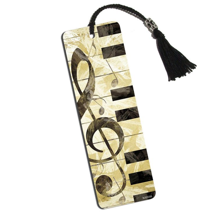 a bookmark with music notes on it and a tassel hanging from the front