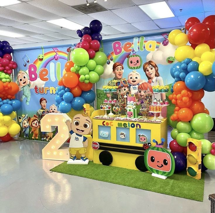 an ice cream truck decorated with balloons and decorations