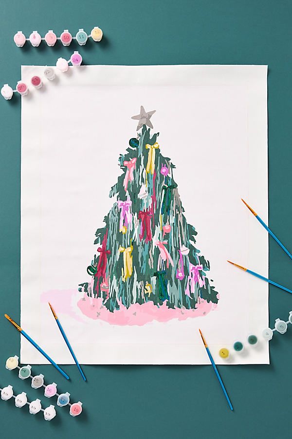 a christmas tree made out of crayons on top of a piece of paper