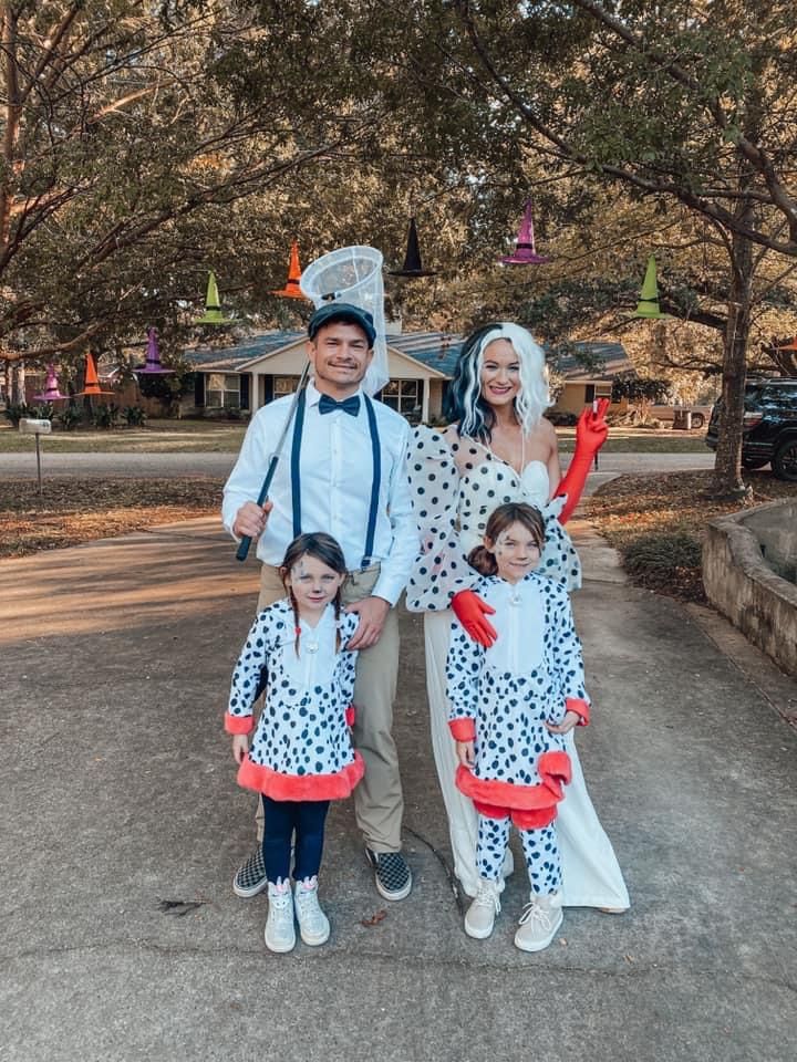 a man and two children dressed up in costumes