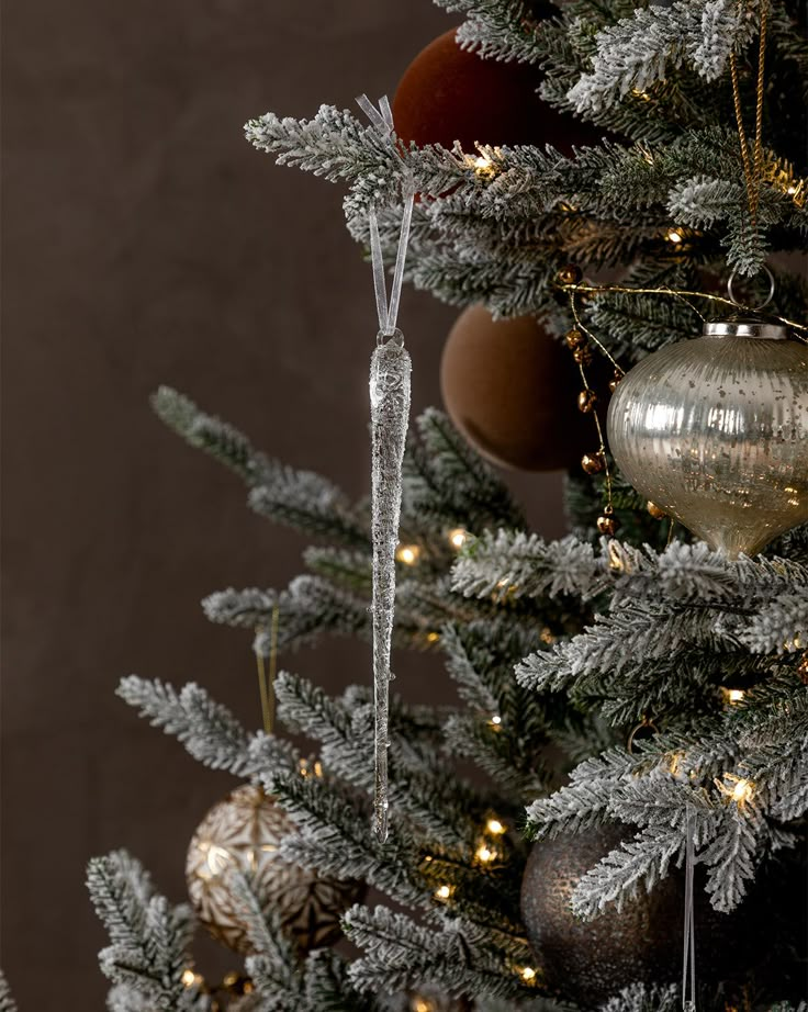 a christmas tree with ornaments hanging from it