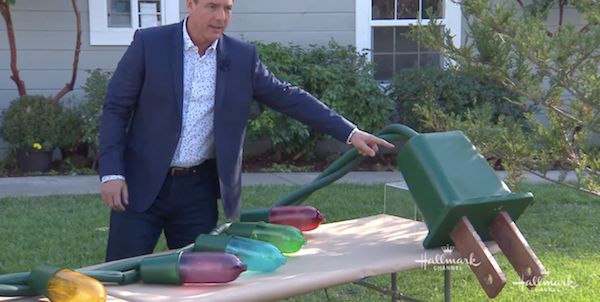 a man standing in front of a table filled with colorful items