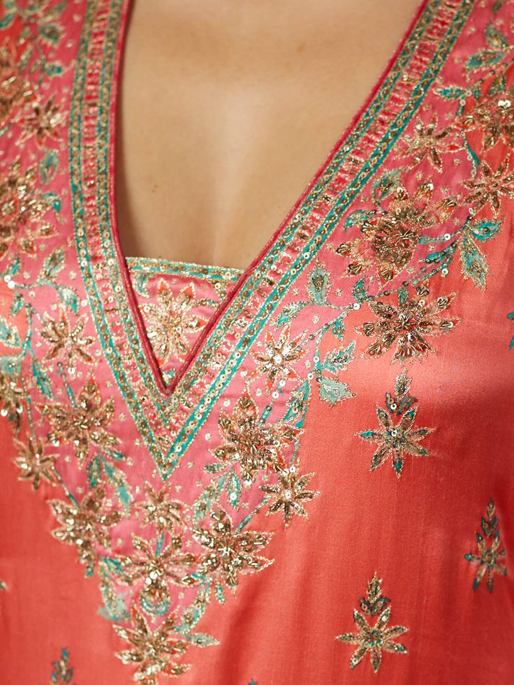 Editor's Note Elevate your ethnic elegance with our coral/pink ari-hand embroidered arin kurta set, including bottoms and a matching dupatta. This ensemble features intricate hand embroidery, making it the perfect choice for special occasions and festive celebrations, exuding timeless charm and style. Color: Pink Fabric: Silk satin Components: Kurta, pants and dupatta Occasion: Festive Note: Product colour may slightly vary due to photographic lighting sources Care: Dry clean only About the Desi Pink Palazzo Set With Dori Work, Pink Anarkali Set For Transitional Season, Silk Palazzo Set With Resham Embroidery In Pink, Pink Silk Palazzo Set With Resham Embroidery, Pink Anarkali Kurta For Transitional Season, Pink Anarkali Kurta For Seasonal Transition, Festive Silk Palazzo Set With Chikankari Embroidery, Pink Silk Palazzo Set With Straight Kurta, Designer Wear Transitional Pink Palazzo Set