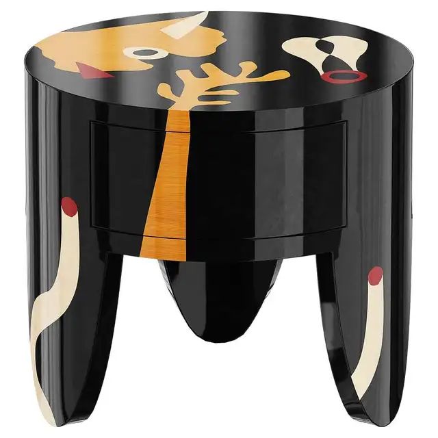 a black and yellow stool with an animal design on the top, sitting in front of a white background