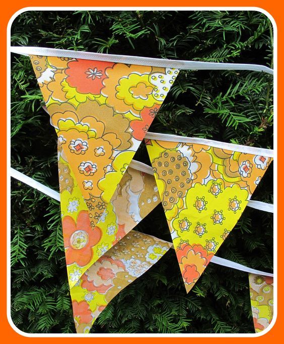 an orange and yellow bunting with flowers on it