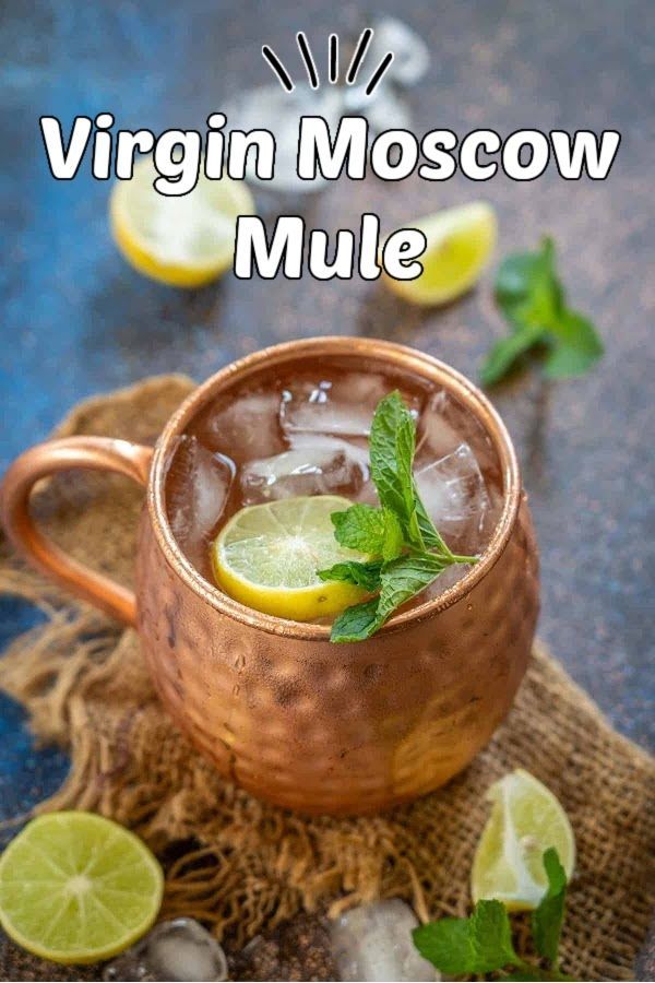 a copper mug filled with ice, lemon and mint garnished with limes