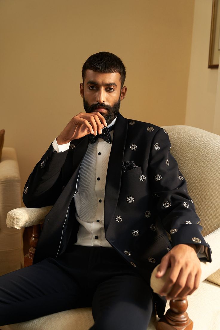 Monogram Tuxedo Set - Contrast by Parth A classic placement of our favourite motif this season, our monogram. On a beautiful blue tuxedo silhouette Included in purchase: Jacket, Kurta and Pants Product Specification Color: Black (can be customized) Fabric: Italian Suiting Occasion: Formal Event, Wedding, Bridal, Reception Style: Tuxedo Designer: Contrast by Parth Care: Dry Clean Only Work: Hand Embroidered, Mirror ( Variation in color, fabric & detail is possible. Model images are only represent Hand Embroidery Indian, Bridal Crop Top, Kaftan Kurta, Pants Embellished, Embroidery Indian, Blue Tuxedo, Kurta Lehenga, Prince Coat, Waistcoat Woman