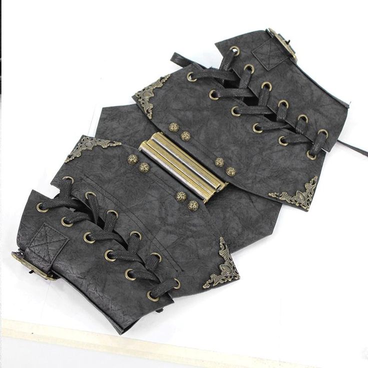 'Nekhbet Steampunk Corset' is the epitome of classic steampunk fashion with its complex metal embellishments and distressed, grainy texture! This corset has not only metal buckles that can be adjusted but also a zipper inside, which makes it incredibly comfortable to wear. The strings on both sides can be adjusted according to your preference too. Product Specifications: Style: Steampunk Fabric: 100% Synthetic Leather Black Steampunk Corset Belt For Halloween, Steampunk Black Corset For Festivals, Black Steampunk Corset For Festival, Black Steampunk Corset Belt For Larp, Black Medieval Corset Belt For Larp, Black Steampunk Corset For Larp, Gothic Black Corset Belt For Larp, Medieval Black Corset Belt For Festivals, Black Gothic Corset Belt For Larp