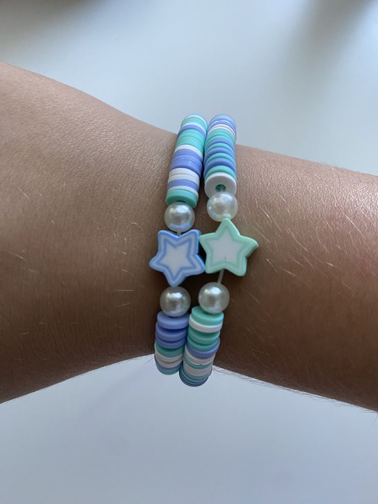 This bracelet is a cute summer friendship bracelet with blue and turquoise stars Cute Blue Beaded Friendship Bracelets, Cute Adjustable Turquoise Beaded Bracelets, Playful Blue Bracelets For Friendship, Playful Blue Beaded Bracelets For Friendship, Playful Blue Friendship Bracelets For Beach, Trendy Turquoise Beaded Bracelets For Friendship, Cute Blue Friendship Bracelets With Letter Beads, Cute Adjustable Star-shaped Bracelets, Cute Adjustable Star Bracelets