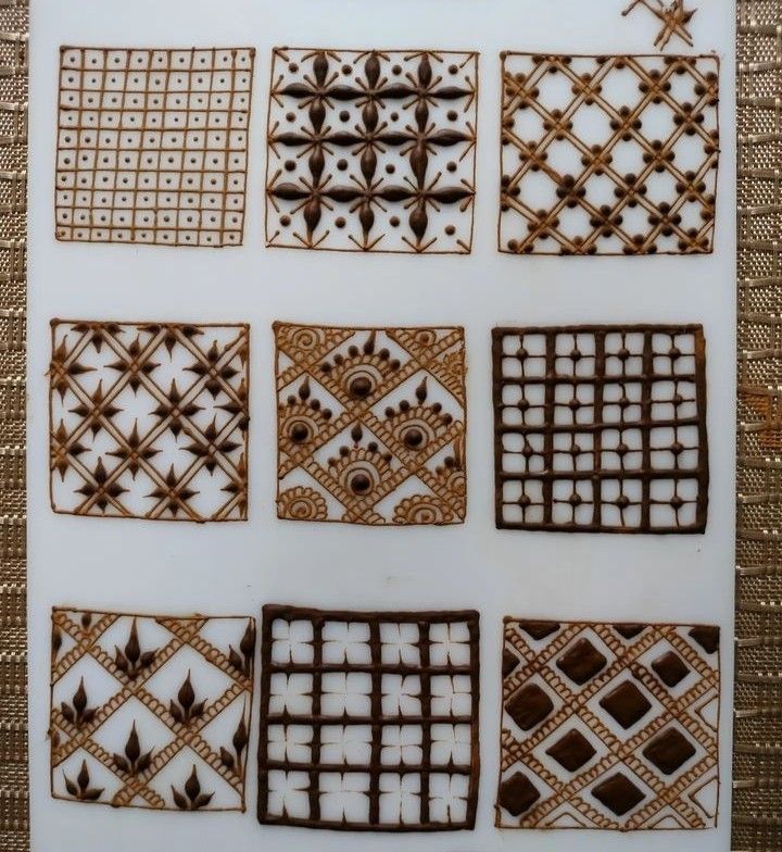 a white plate topped with lots of brown and white designs on it's sides