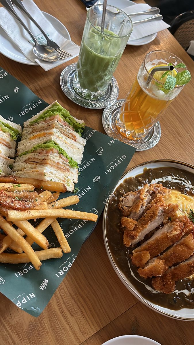 sandwiches and french fries are on a table