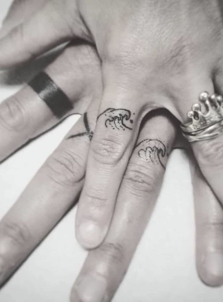 two people with matching rings on their fingers