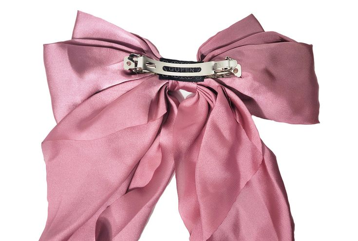 Fun, flirty and feminine piece that reflects the latest Fall trend and takes us back to Avonlea. This is the ultimate statement bow, pre-tied with a barrette closure on the back. Product Details: Satin blend Imported Barrette closure Oversized styling 8 x 16 inches Chic Detachable Bow For Summer, Chic Evening Bow For Spring, Chic Satin Bow For Spring, Summer Party Bow Tie With Detachable Bow, Chic Evening Bow With Detachable Feature, Chic Party Hair Accessories With Ribbon, Chic Ribbon Hair Accessories For Party, Chic Summer Evening Hair Accessories, Summer Party Hair Accessory With Decorative Bow