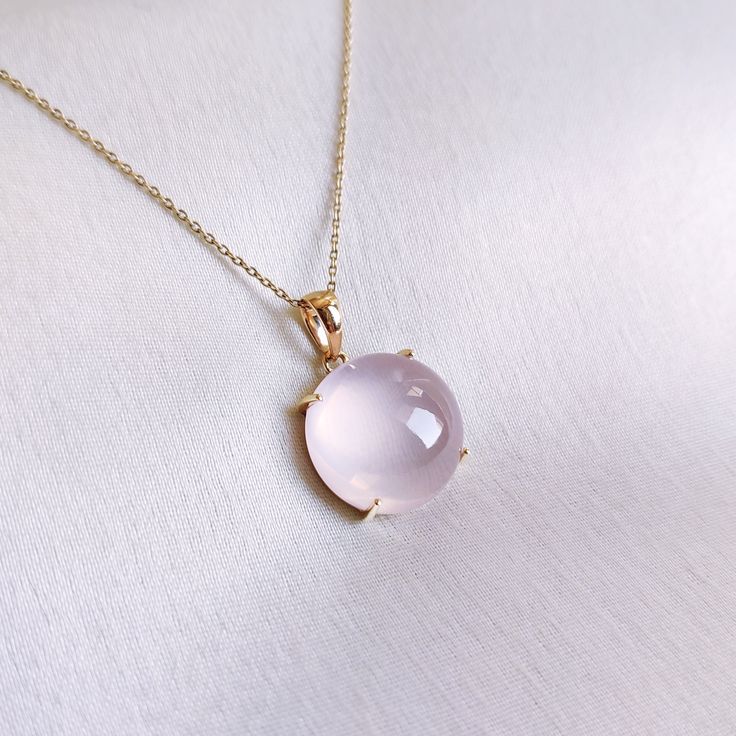 This stunning pendant is set in 14k Solid Yellow Gold with Natural Rose Quartz with utmost precision. It is an unique gemstone pendant for nearly every occasion and is completely hassle-free jewelry. 🔷ABOUT GEMSTONE:  Rose quartz is often called the "Stone of Love" and is believed to promote all forms of love, including self-love, romantic love, and love for others. It can help individuals open their hearts to love and develop a greater sense of compassion and empathy. Rose quartz is often call Elegant Round Gemstones For Gifts, Elegant Gemstones For Gifts, Fine Jewelry Cabochon Gemstones As Gift, Fine Jewelry Cabochon Gemstones For Gifts, Fine Jewelry Round Gemstones For Gifts, Fine Round Gemstones As Gift, Fine Round Gemstones For Gifts, Elegant Round Birthstone Gemstones, Pink Gold Jewelry With 17 Jewels For Gift