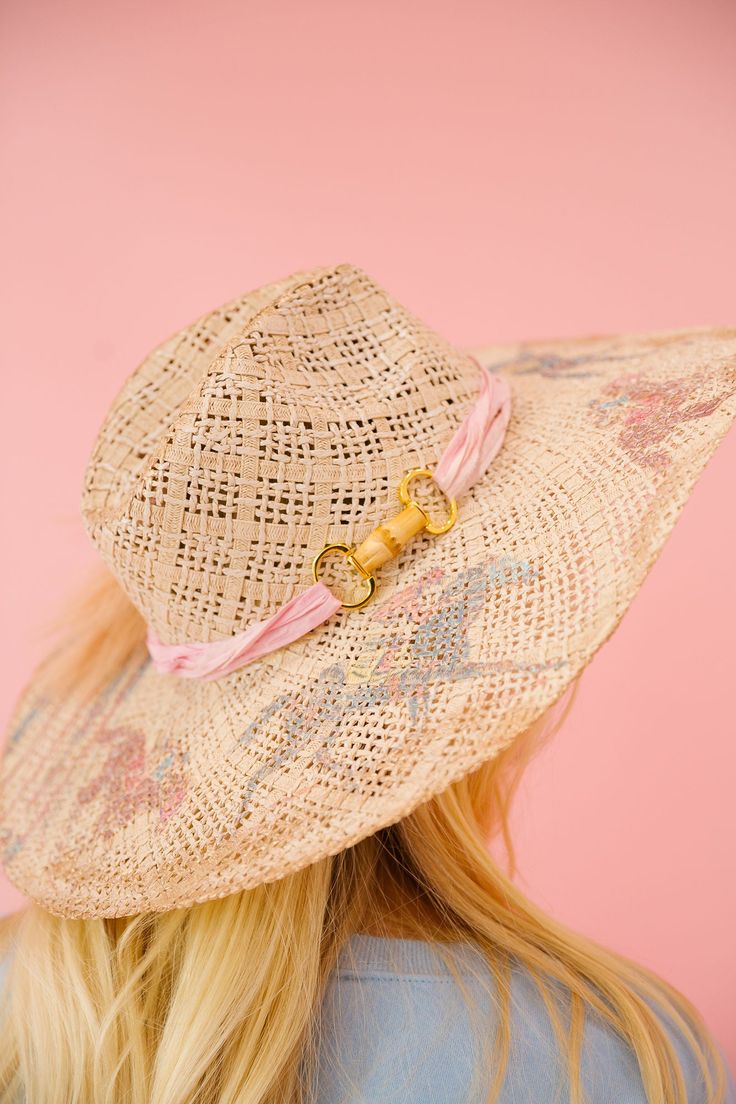 Upgrade your summer style with the LETS RACE SUN HAT! This cream sun hat features a playful racing horse design and a stylish pink ribbon band with a gold horse bit accent. Perfect for a day at the races or a sunny day at the beach. Don't horse around without this must-have accessory! This hat is ONE OF A KIND, created by our owner Stephanie. To receive item quicker, expedited shipping is available at checkout. Pink Summer Sun Hat For Kentucky Derby, Pink Western Straw Hat For Summer, Pink Adjustable Hat Bands For Summer, Gold Hat Bands For Rodeo Summer, Gold Hat Bands For Rodeo In Summer, Gold Hat Bands For Rodeo Summer Events, Gold Hat Bands For Summer Rodeo, Gold Hat Bands For Rodeo, Pink Beach Hat Bands