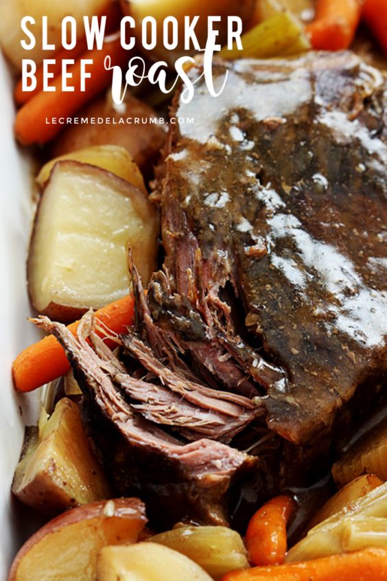 slow cooker beef and vegetables in a white dish with text overlay that reads slow cooker beef and vegetables