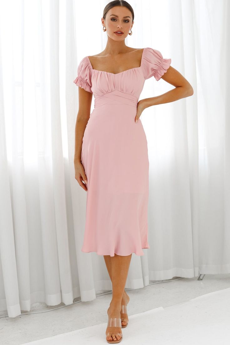 Blush midi dress  Partially lined  Off-shoulder style  Ruched bodice  Elasticated puff sleeves  Tie at back  Zipper in back   Stop what you are doing because this dress deserves a moment. Jaws will drop when you strut by in our adorable Linka midi dress. Featuring an off-shoulder style and the cutest puff sleeves, we're head over heels! Perfect for a wedding or special occasion paired with strappy heels and statement earrings. Hello, gorgeous! Blush Midi Dress, Hot Party Dresses, Selfie Leslie, Light Pink Dress, Off Shoulder Fashion, Blush Dresses, Head Over Heels, Hello Gorgeous, Pink Midi Dress