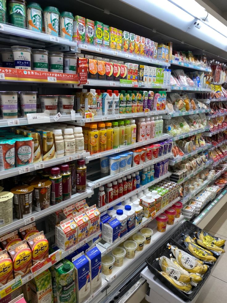 an aisle in a grocery store filled with lots of food and drinks on the shelves