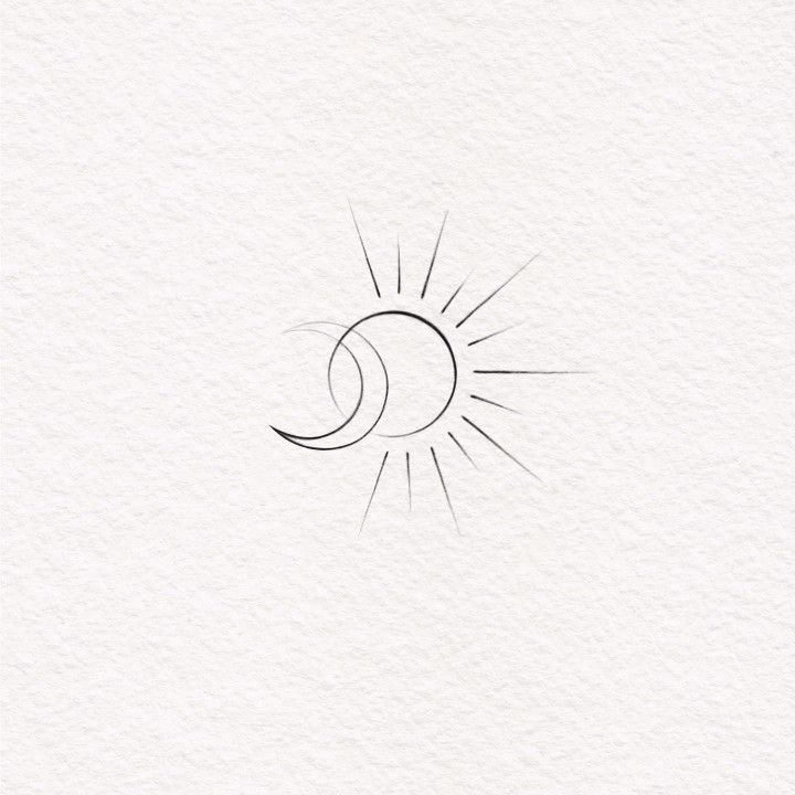 the sun and moon are drawn on paper