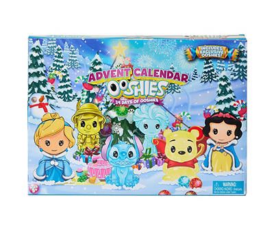 the children's christmas calendar is displayed in front of snow covered trees and evergreens