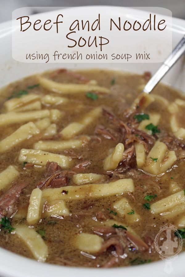 beef and noodle soup in a white bowl with a spoon on the side text reads beef and noodle soup using french onion soup mix