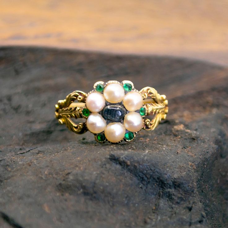 This lovely antique ring feature Moonstone decorated with Pearls accented with Emeralds crafted in 14ct. Design Era: Early Victorian (1837-1855). Size: 16.71 NL / 52.5 FR / 6¼ US / M UK Dimensions: H 0.4 X L 1 x W 1 cm. Weight in grams: 3,5. Condition: Very good condition - slightly used with small signs of wear. Resizing possible (contact seller for information). Registered Shipping or Local Pickup at our store (in case of Local Pickup; shipping cost if applicable will be refunded). Looking for Antique Emerald Engagement Ring, Edwardian Jewelry, Shiny Objects, Jewelry Details, Antiques Jewelry, Beautiful Wedding Rings, Antique Ring, Emerald Engagement Ring, Multi Stone Ring