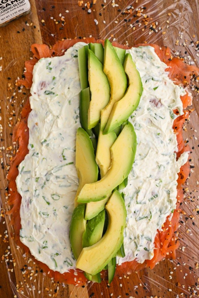 an avocado is sliced into pieces on top of some bread and sprinkled with seasoning