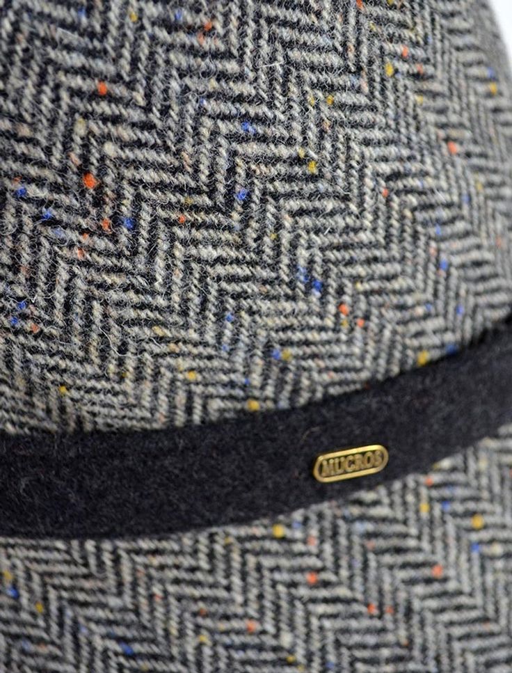 Look smart and sharp in this Clodagh Hat from Mucros Weavers. In beautiful Fall colors, these hats feature a structural brim that can be worn flat or folded up. Finishing touch the dark band with matching colorful buttons. 100% Wool Fall Herringbone Hat With Short Brim, Casual Brimmed Hat With Herringbone Pattern, Adjustable Herringbone Pattern Hat For Winter, Winter Hats With Herringbone Pattern And Curved Brim, Adjustable Winter Hat With Herringbone Pattern, Adjustable Short Brim Hat With Herringbone Pattern, Casual Black Tweed Hat, Black Casual Tweed Hat, Adjustable Brimmed Hat With Herringbone Pattern