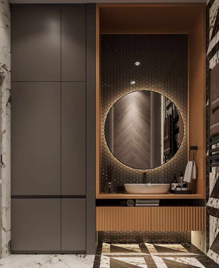 a bathroom with marble flooring and a round mirror on the wall above the sink