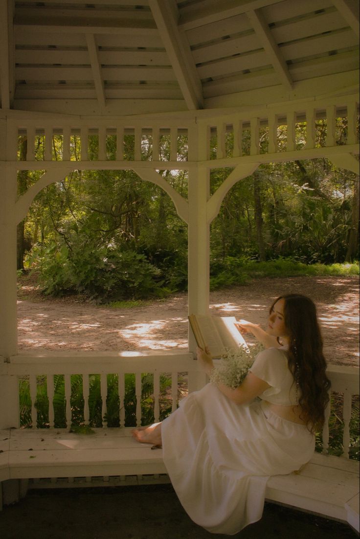 white dress, white gazebo, dreamy photoshoot, fairy, fairy vibes, fairy photoshoot, 70s style white dress, auburn hair, romeo and juliet, academia, reading, book photoshoot, photography ideas. Cottagecore Dress Photoshoot, Fairy River Photoshoot, Princess Style Photoshoot, White Dreamy Dress, Cottagecore Indoor Photoshoot, Fairy Like Photoshoot, Desi Senior Pictures, Cottage Photoshoot Ideas, Tea Party Senior Pictures