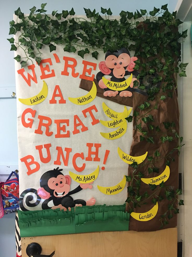 there is a bulletin board with monkeys and bananas on the front, along with words that read we're a great bunch