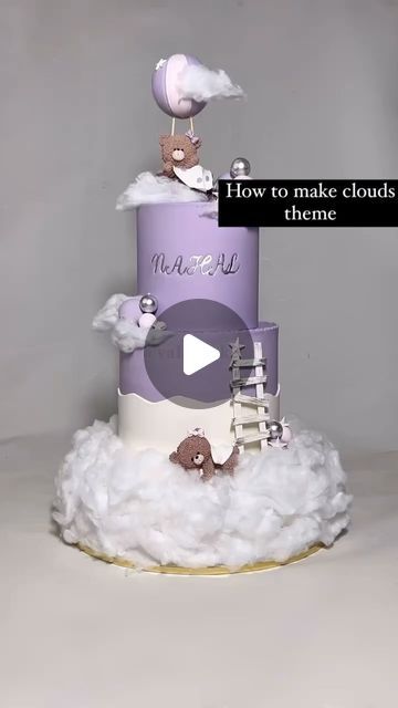 a three tiered cake with birds on top and the words how to make clouds theme