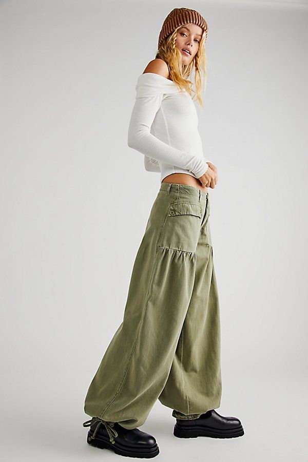 So cool balloon-style jeans from our We The Free collection featured in a mid-rise silhouette with dropped, front patch-style pockets and cinch-tie banded ankles with femme pleating throughout for added dimension. * Zip-fly and button closure * Soft, stretch denim * Belt loops at waist | We The Free Lotus Jeans at Free People in Green, Size: 25 Free People Aesthetic, Bohemian Pants, Patches Fashion, Denim Belt, Free People Style, All Jeans, Free People Clothing, Free People Jeans, Bottom Clothes