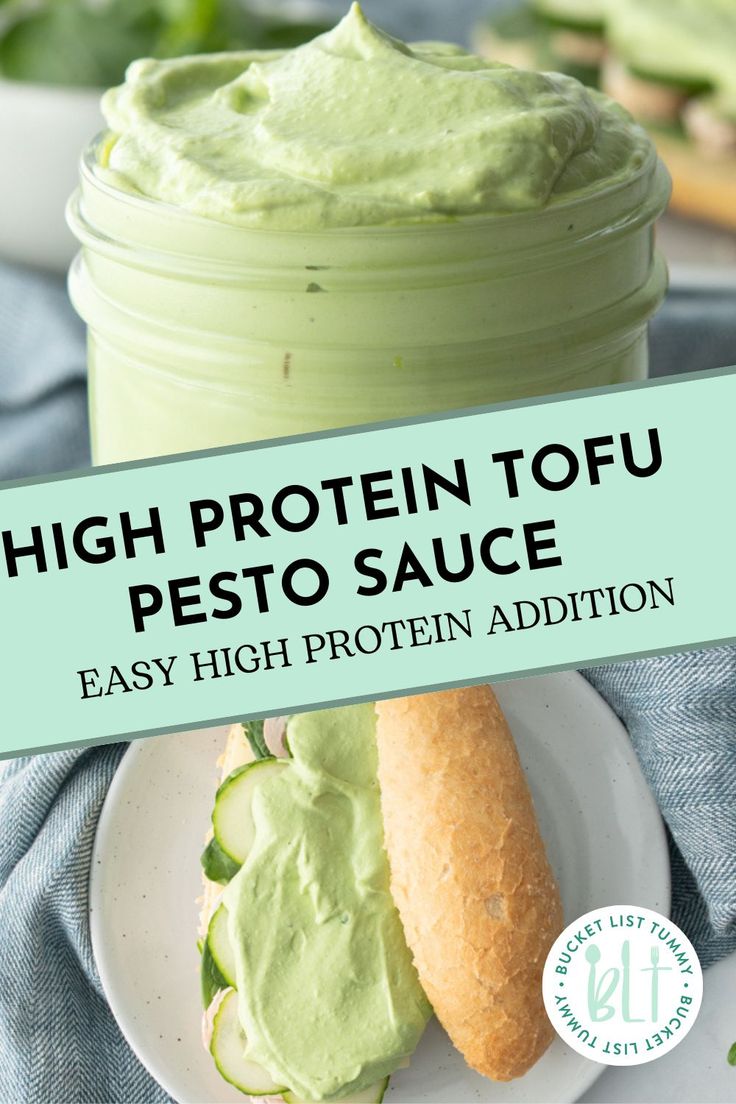 high protein tofu pesto sauce in a jar with a sandwich on a plate