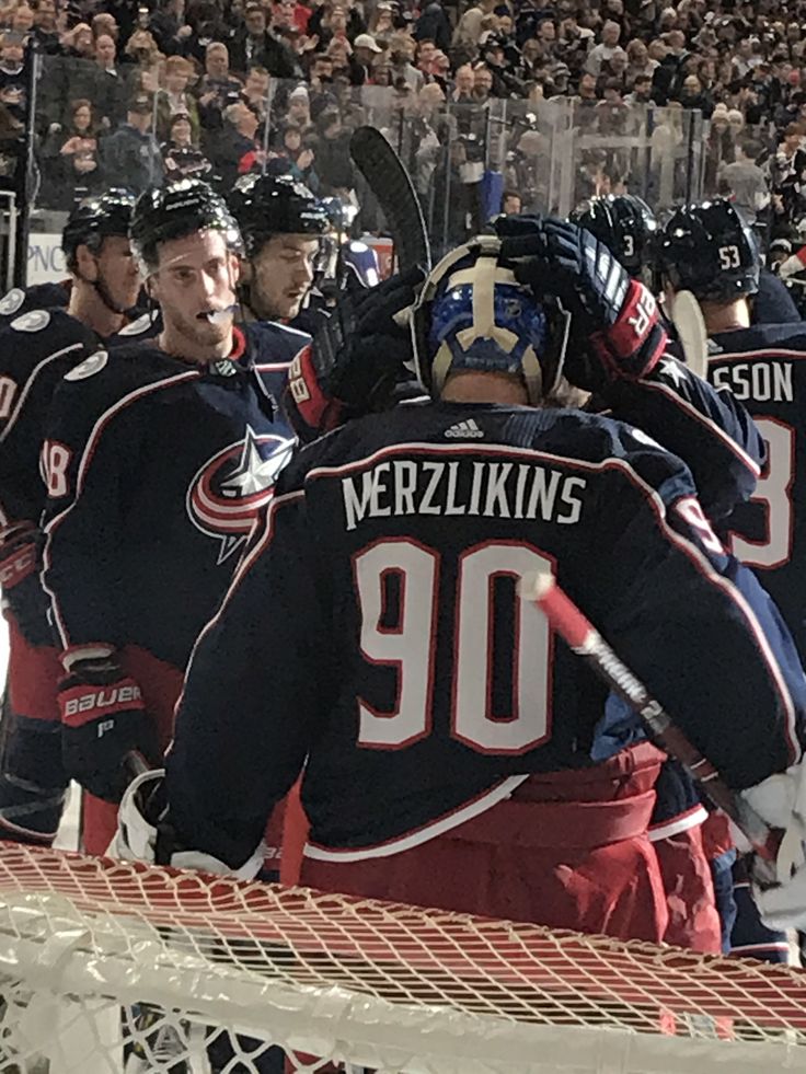 the hockey players are congratulating each other