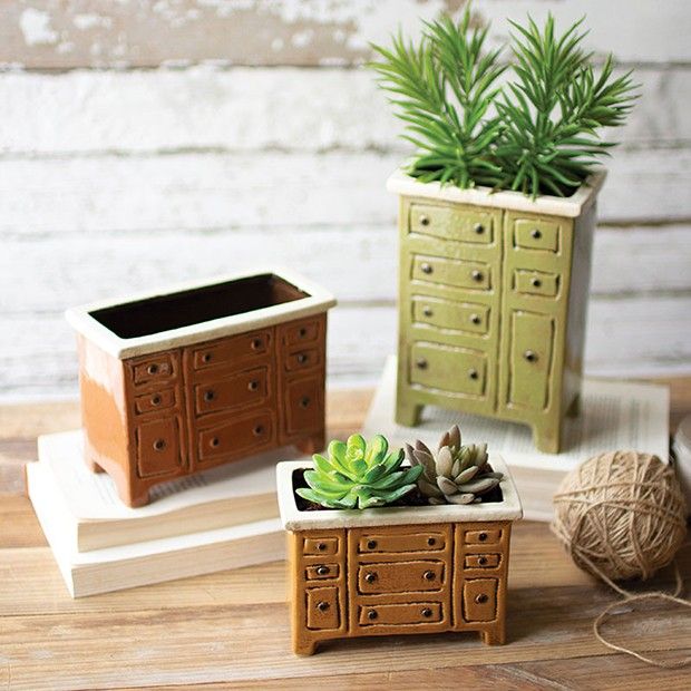 three small planters sitting on top of wooden boxes next to a ball of twine