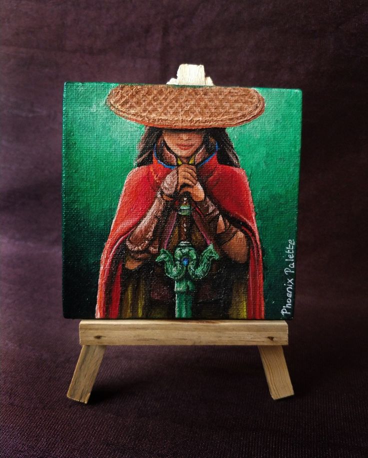 a painting of a woman wearing a straw hat and holding a pipe on an easel