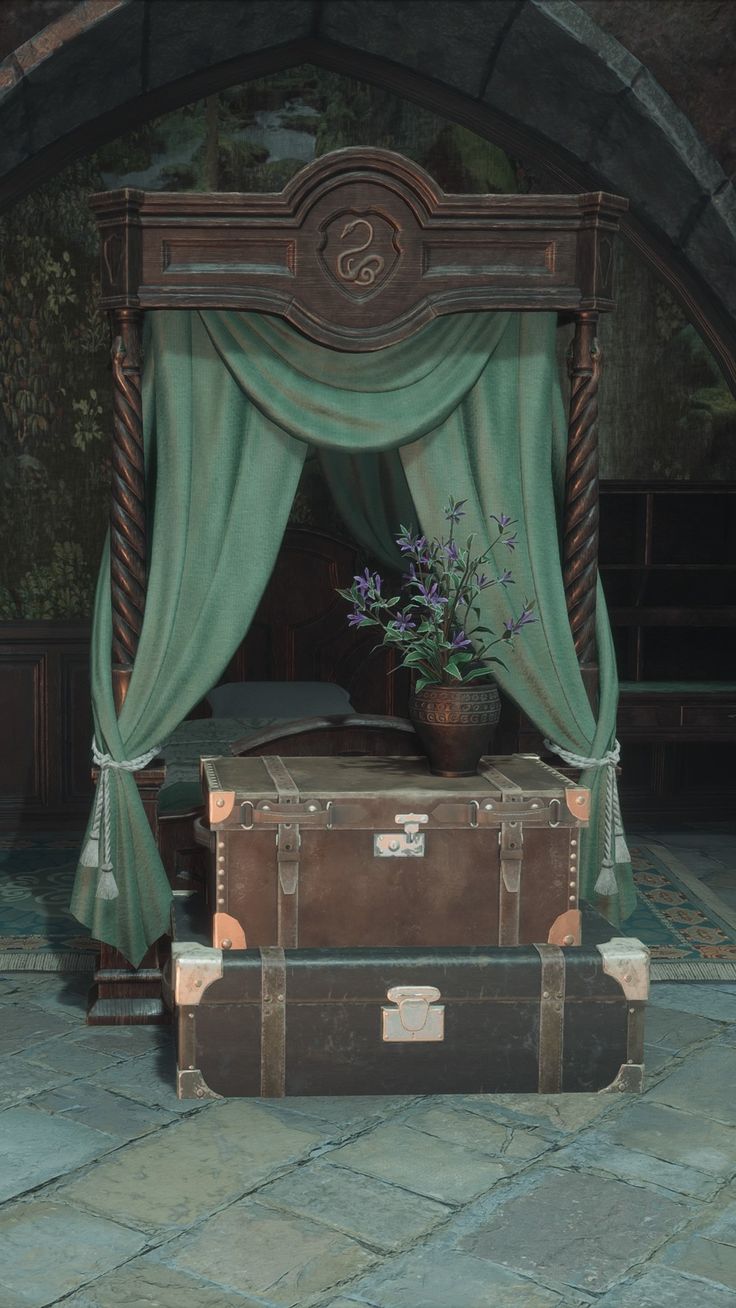 an old trunk is sitting in front of a canopy bed