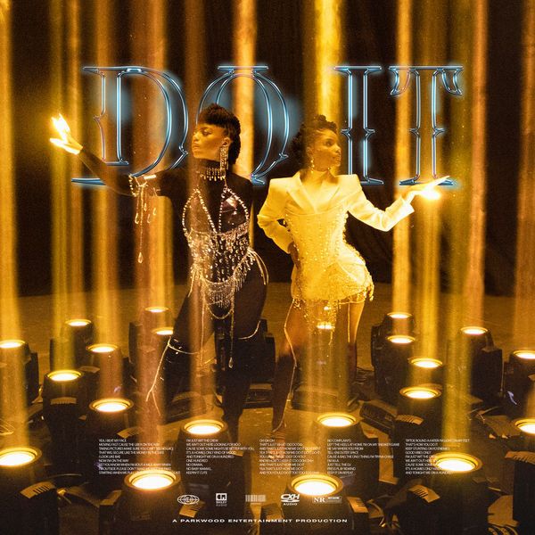 two people standing next to each other in front of candles and letters that spell out do it