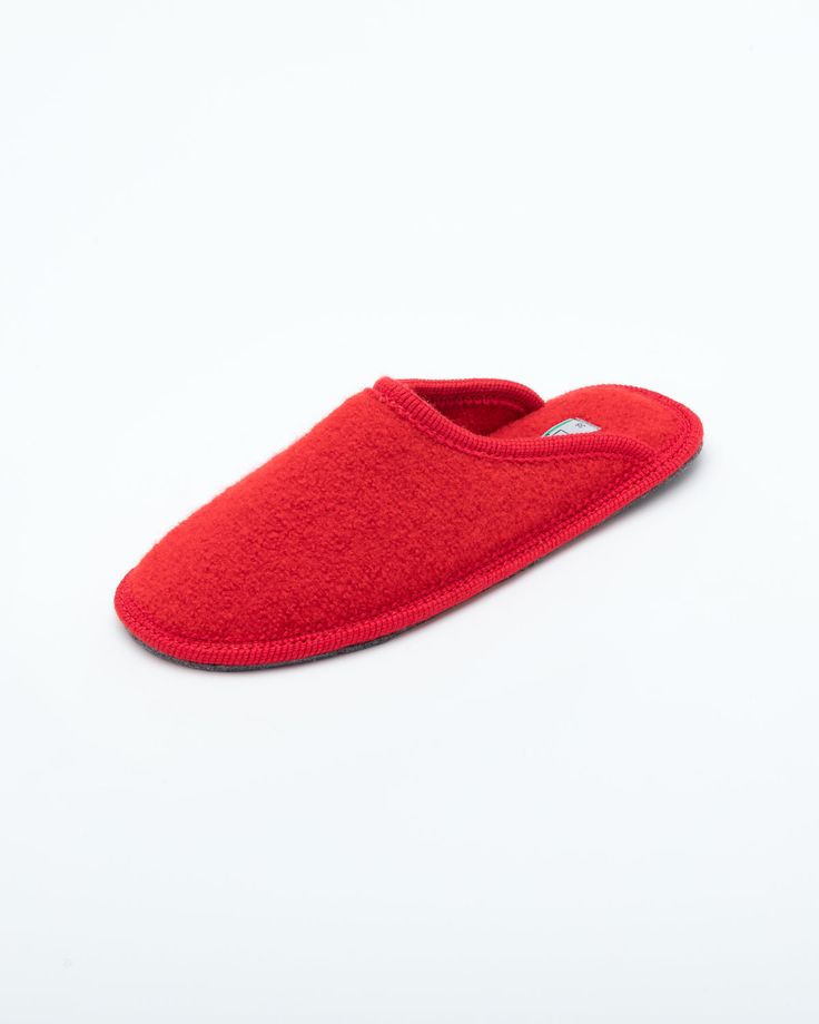 The Le Clare women's Stella in red is the classic "hotel slipper" reimagined in luxurious boiled wool. This quintessential slipper provides delicate comfort, featuring our premium Italian boiled wool fiber, the slipper gently conforms to your foot for cozy comfort. Classic Closed Toe Winter Slippers, Red Round Toe Slippers For Indoor Use, Wool Slippers With Leather Sole For Winter, Indoor Wool Slippers With Rubber Sole, Winter Wool Slippers With Leather Sole, Winter Indoor Felt Slippers, Red Comfortable Slip-on Slippers, Comfortable Red Slip-on Slippers, Red Slip-on Slippers With Leather Sole