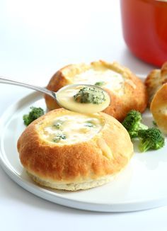 broccoli and cheese rolls on a white plate